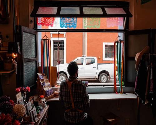 Person working in a beautifully illuminated modern apartment in Mexico City, managing ambient light comfortably